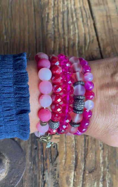 Hot Pink Bracelet stack with upcycled emblem