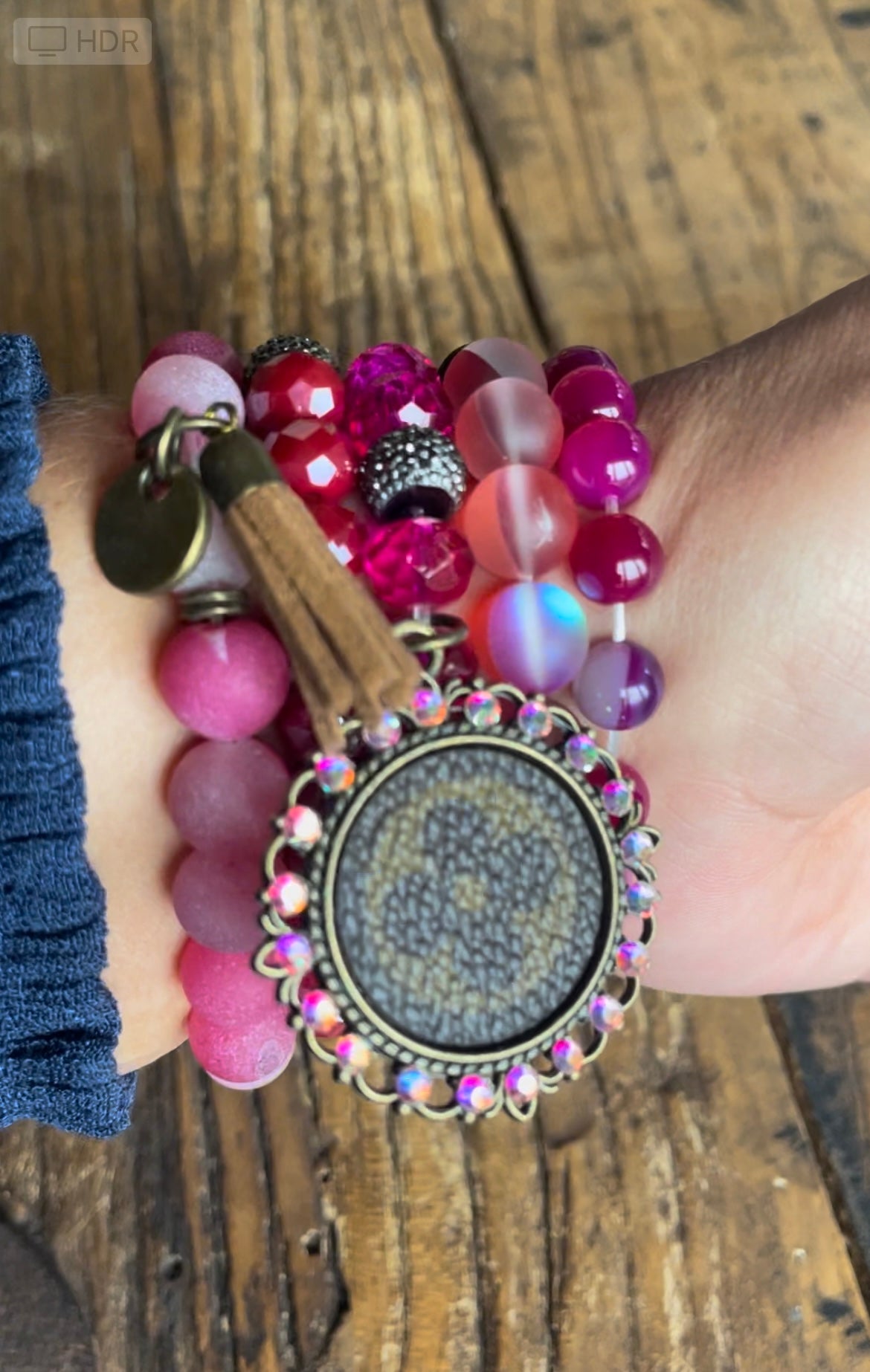 Hot Pink Bracelet stack with upcycled emblem