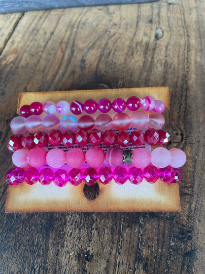 Hot Pink Bracelet stack with upcycled emblem